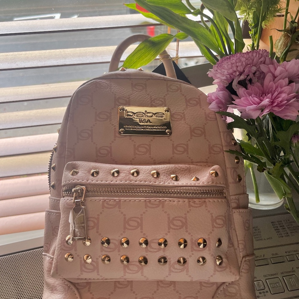 NWT BEBE Jett Monogram Pink Backpack.
